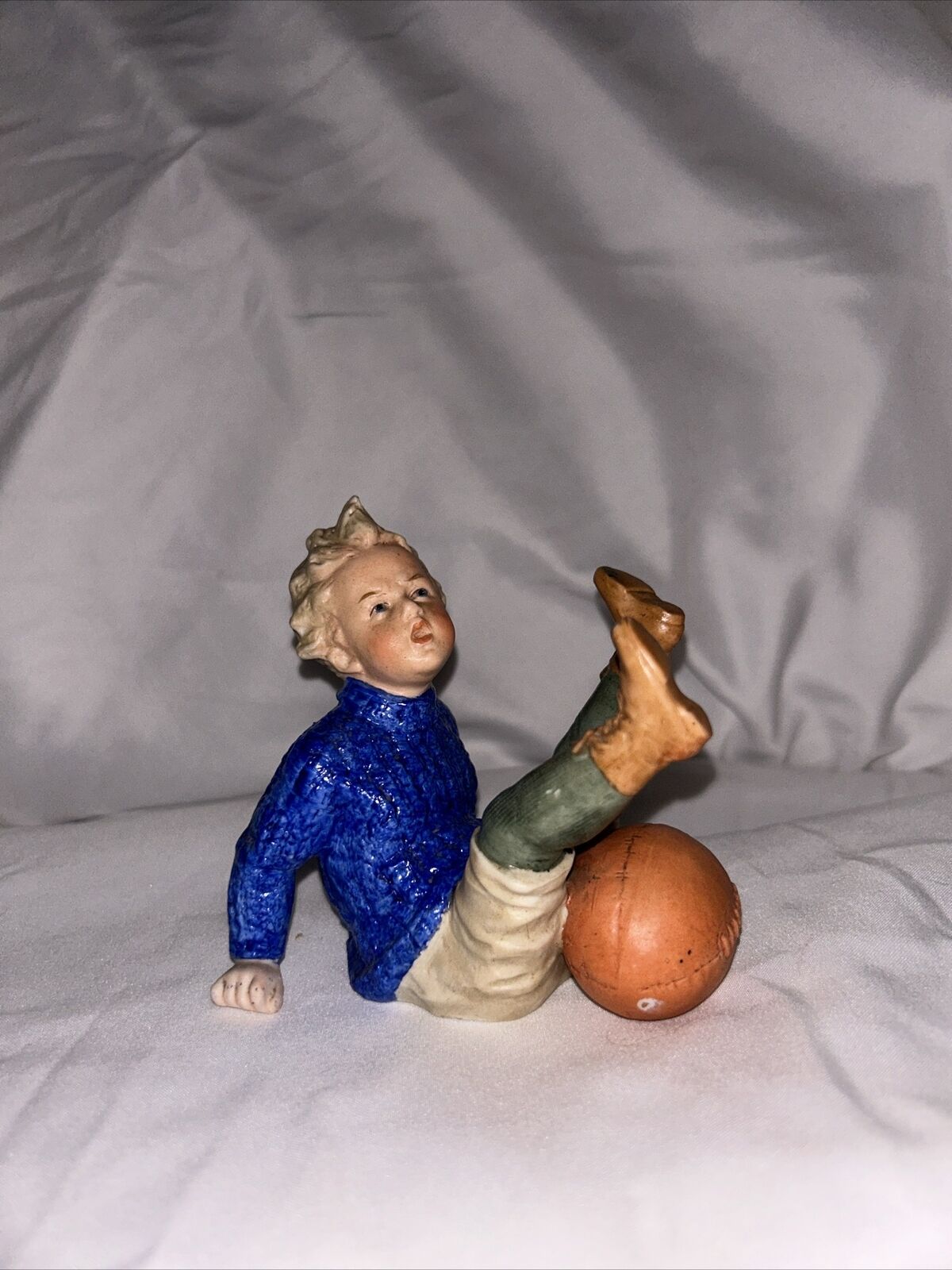 Heubach German bisque porcelain football figurine
