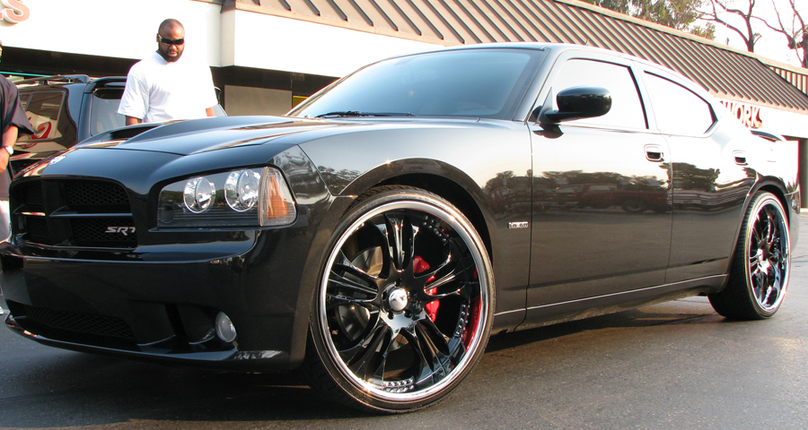 This is Tommy Kelly of the Oakland Raiders and his Black Dodge Charger SRT8.