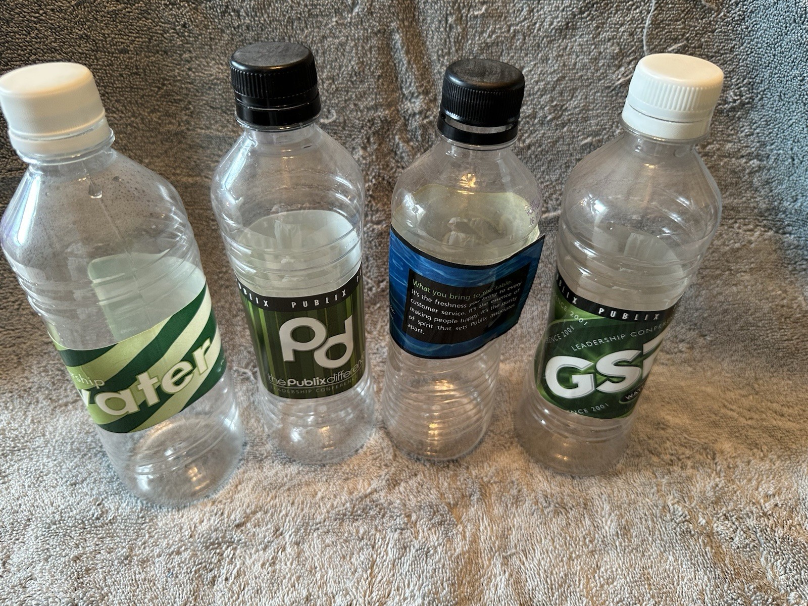 Four Empty Themed Water Bottles from Past Publix ROC Four Empty Themed Water Bottles from Past Publix ROC