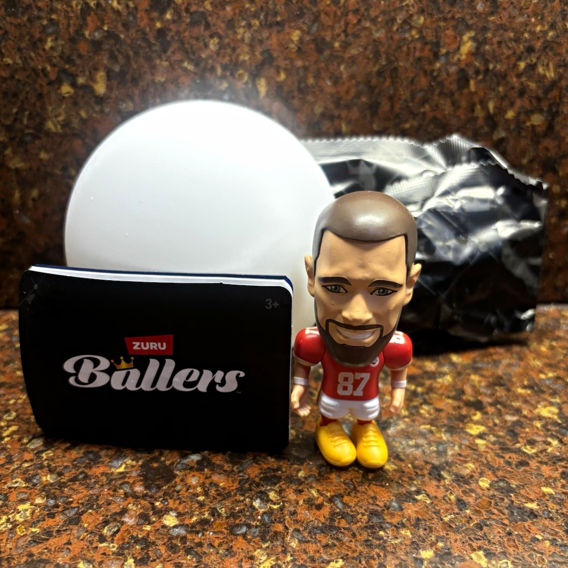 ZURU Ballers Travis Kelce #87 Red Jersey w/ Accessory Original Package Opened ZURU Ballers Travis Kelce #87 Red Jersey w/ Accessory Original Package Opened