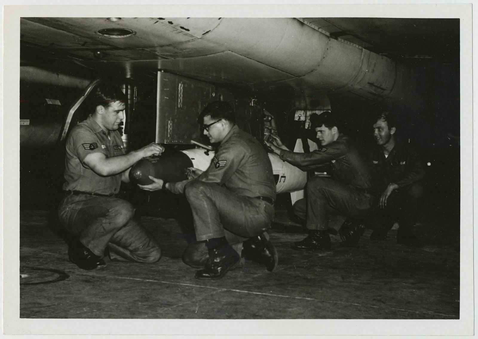 Loading a Bomb onto a US Air Force F-100 A/C Bomber 1960's Loading a Bomb onto a US Air Force F-100 A/C Bomber 1960's