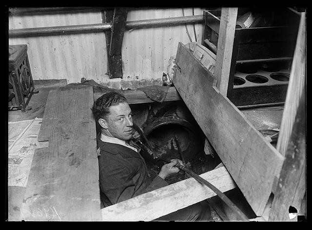 Photo:Man in boiler room 1900s workman industrial interior photograph Photo:Man in boiler room 1900s workman industrial interior photograph