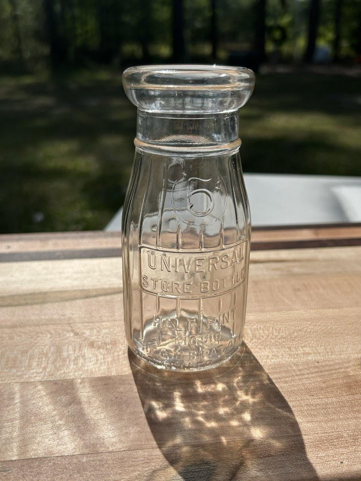 Vintage Universal Store 5 Cent Half Pint Milk Bottle, Embossed Clear Glass