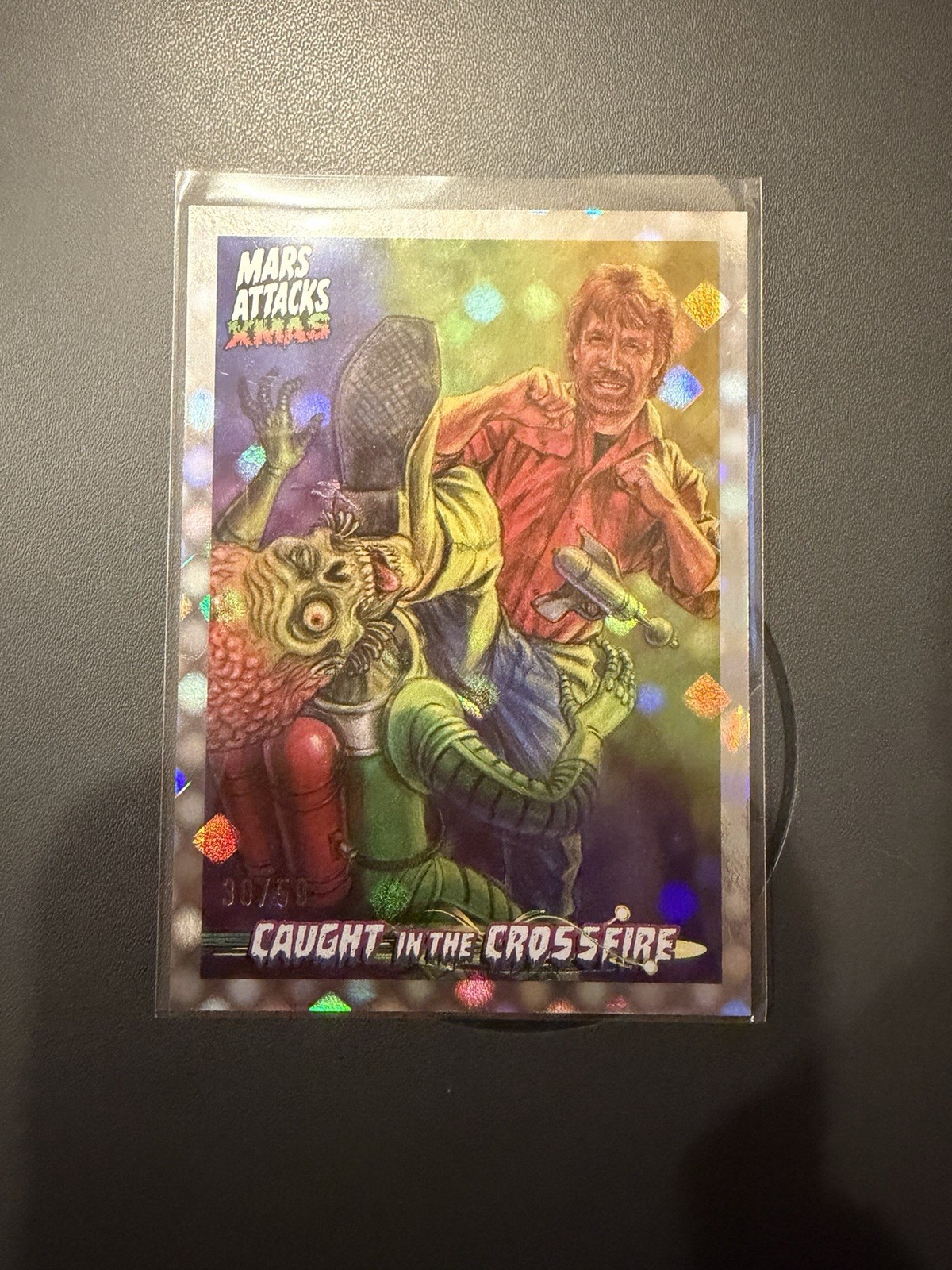 2026 Topps Mars Attacks XMAS Chuck Norris Caught in the Crossfire Dotz /50 CC-CN 2026 Topps Mars Attacks XMAS Chuck Norris Caught in the Crossfire Dotz /50 CC-CN