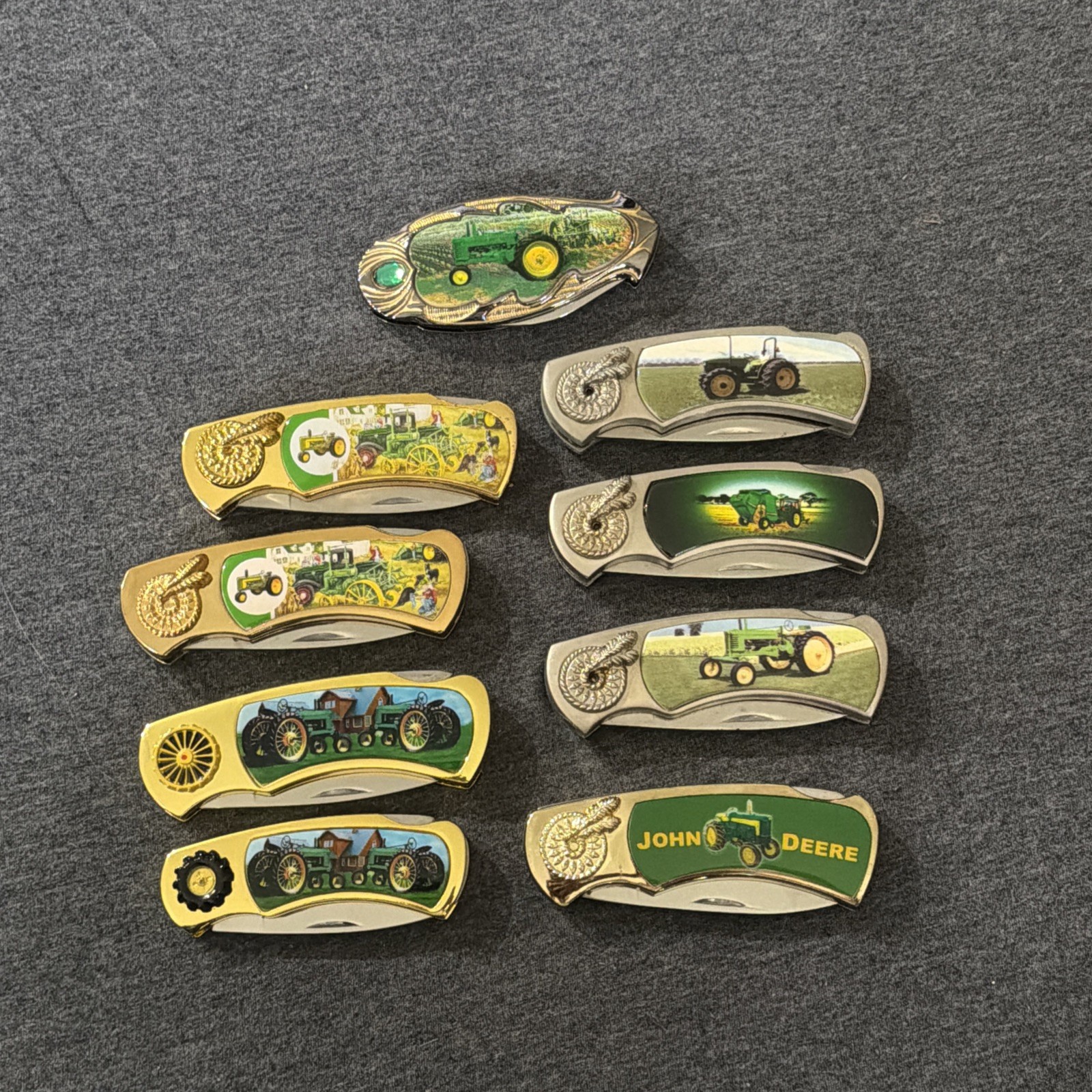 John Deere Collectable knives lot of 9 John Deere Collectable knives lot of 9