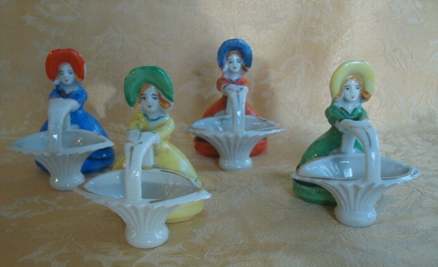 4 Vtg Japan Porcelain Girl W Hat Holds Basket Figurines ~ Red/Blue/Green/Yellow 4 Vtg Japan Porcelain Girl W Hat Holds Basket Figurines ~ Red/Blue/Green/Yellow