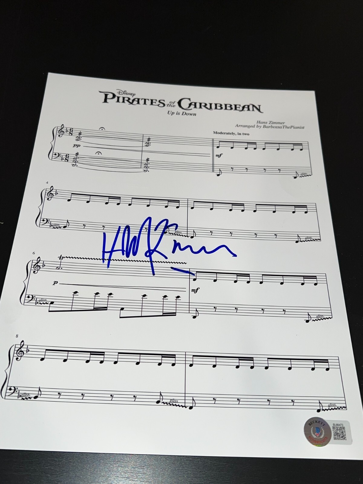 HANS ZIMMER SIGNED AUTOGRAPH SHEET MUSIC PIRATES OF THE CARIBBEAN BECKETT BAS D HANS ZIMMER SIGNED AUTOGRAPH SHEET MUSIC PIRATES OF THE CARIBBEAN BECKETT BAS D