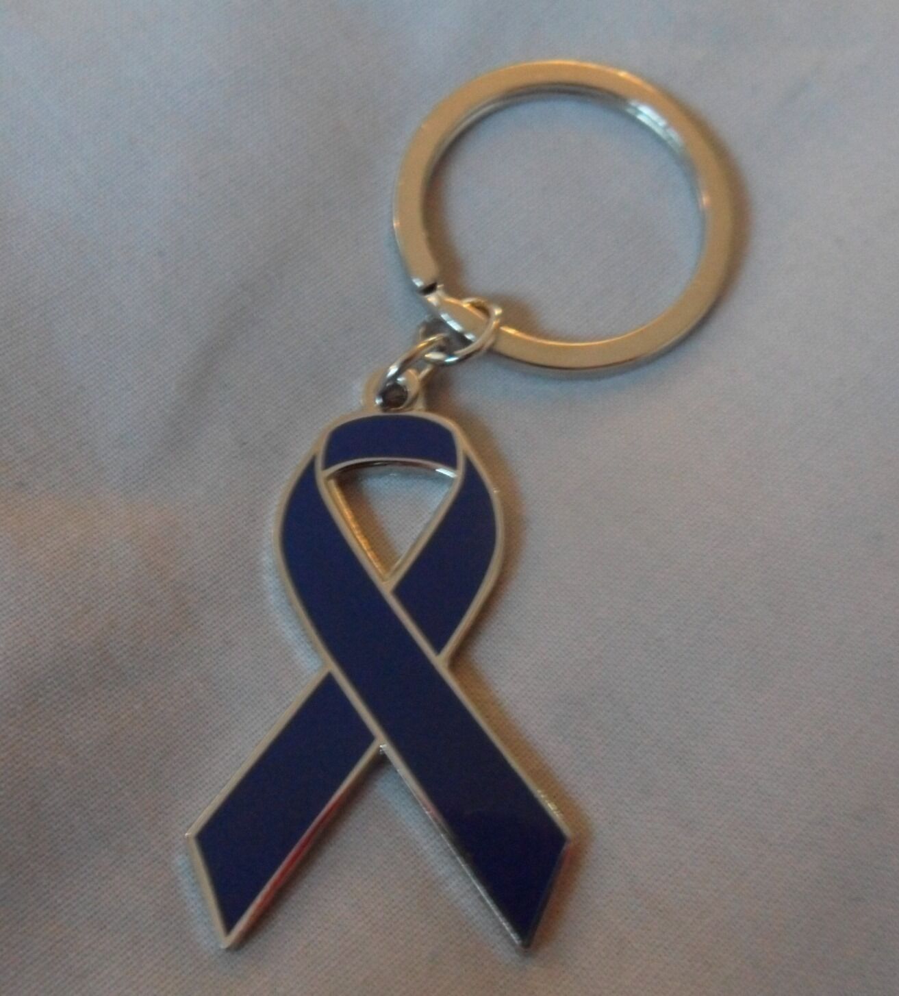 Usher Syndrome Awareness royal blue ribbon enamel keyring. Charity, badge