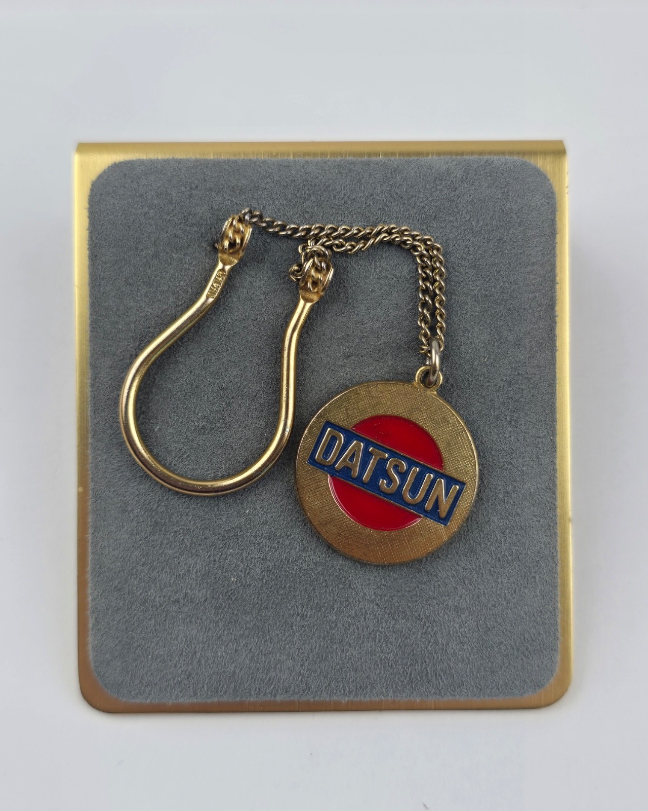 Vintage Datsun Automobile keychain fob gold tone red & blue enamel