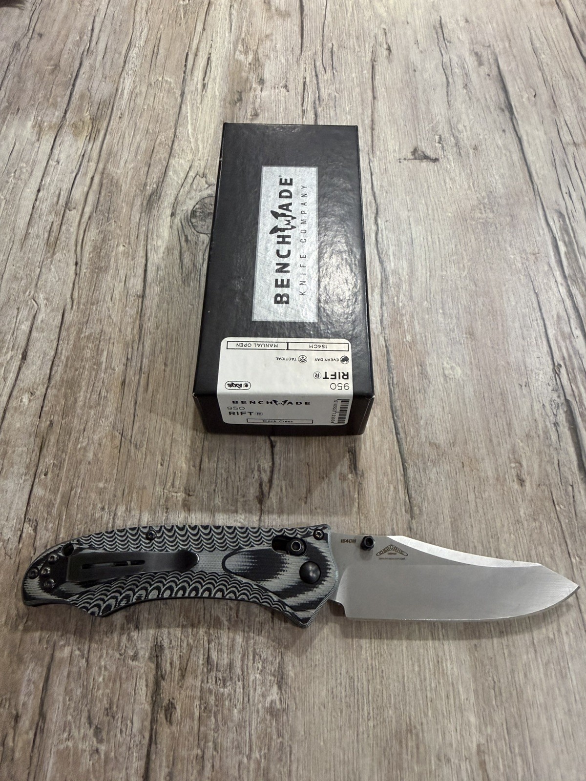 Benchmade Osborne 950 Rift, Gray/Black, 154 CM Plain Edge, Used. Discontinued Benchmade Osborne 950 Rift, Gray/Black, 154 CM Plain Edge, Used. Discontinued