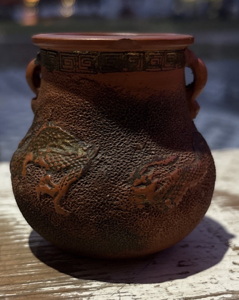 Vintage Tokoname red clay miniature dragon urn vase with gilded accents. Vintage Tokoname red clay miniature dragon urn vase with gilded accents.