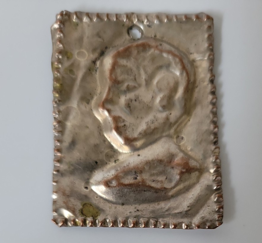 Antique Ex Voto Silver Metal Small Embossed Repoussé Design of a Head of Wisdom Antique Ex Voto Silver Metal Small Embossed Repoussé Design of a Head of Wisdom