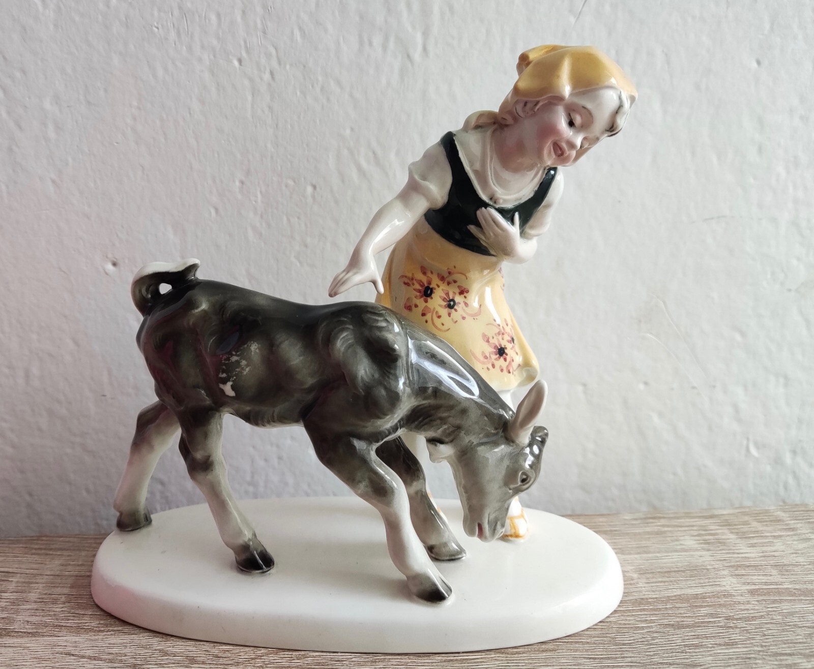 Figurine "Girl with a Calf", faience, Hertwig & Co., Germany, 1914-1944. Rare