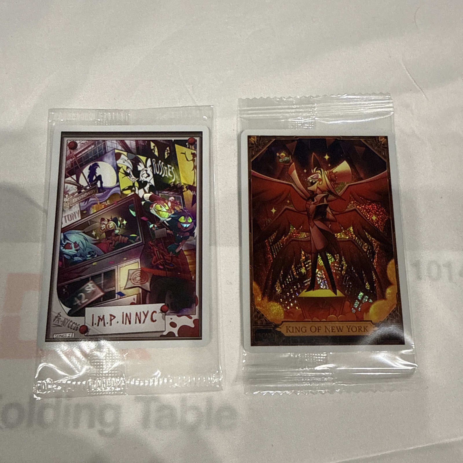 Hazbin Hotel Lucifer King of New York Promo Card New York Comic Con 2026 both Hazbin Hotel Lucifer King of New York Promo Card New York Comic Con 2026 both