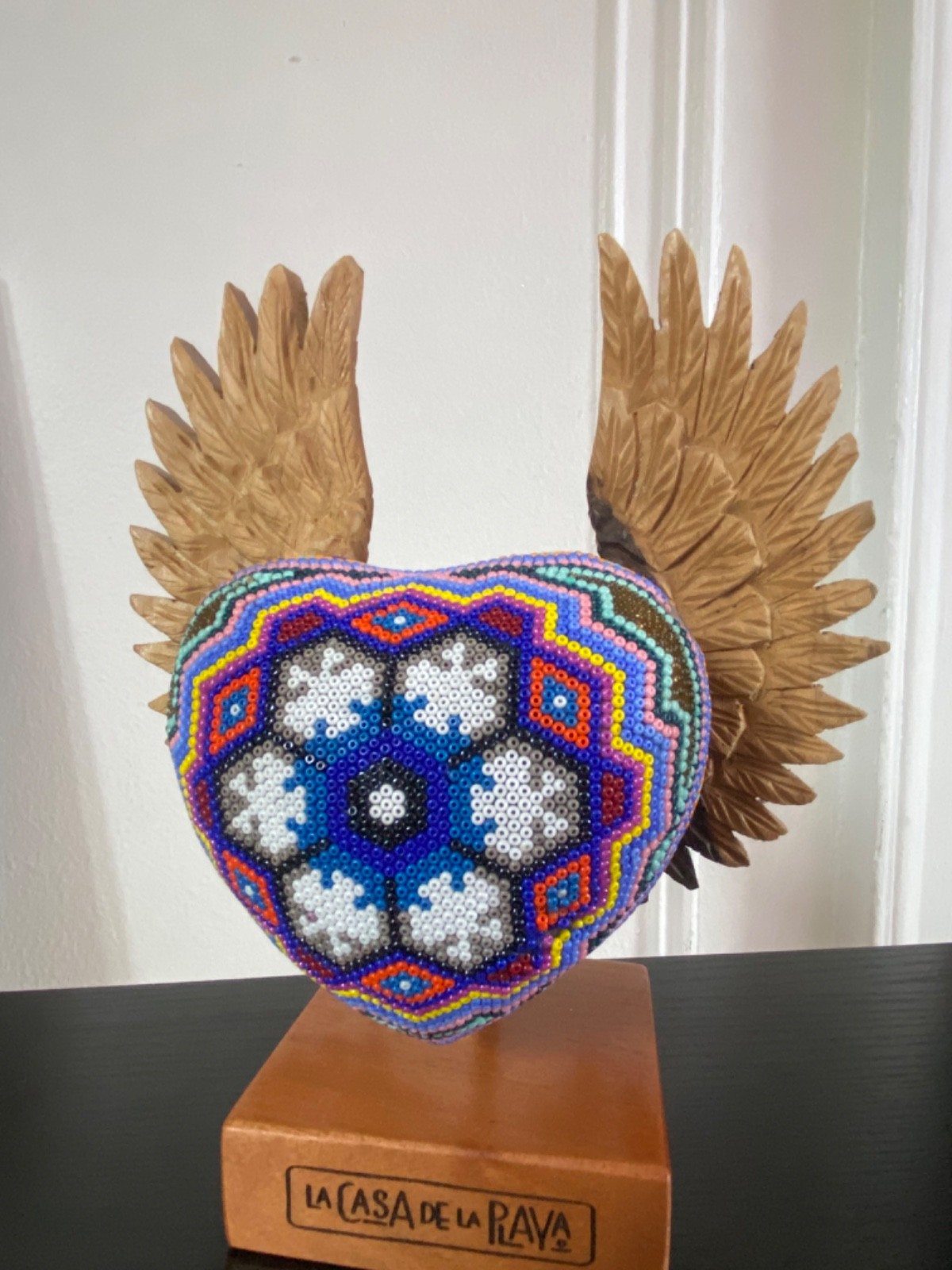 La Casa de la Playa Beaded Heart with Wings Huichol Wooden Stand La Casa de la Playa Beaded Heart with Wings Huichol Wooden Stand