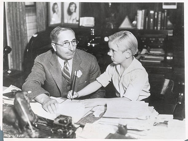 Skippy Signs Contract Seven year old Jackie Cooper is shown as he - Old Photo Skippy Signs Contract Seven year old Jackie Cooper is shown as he - Old Photo