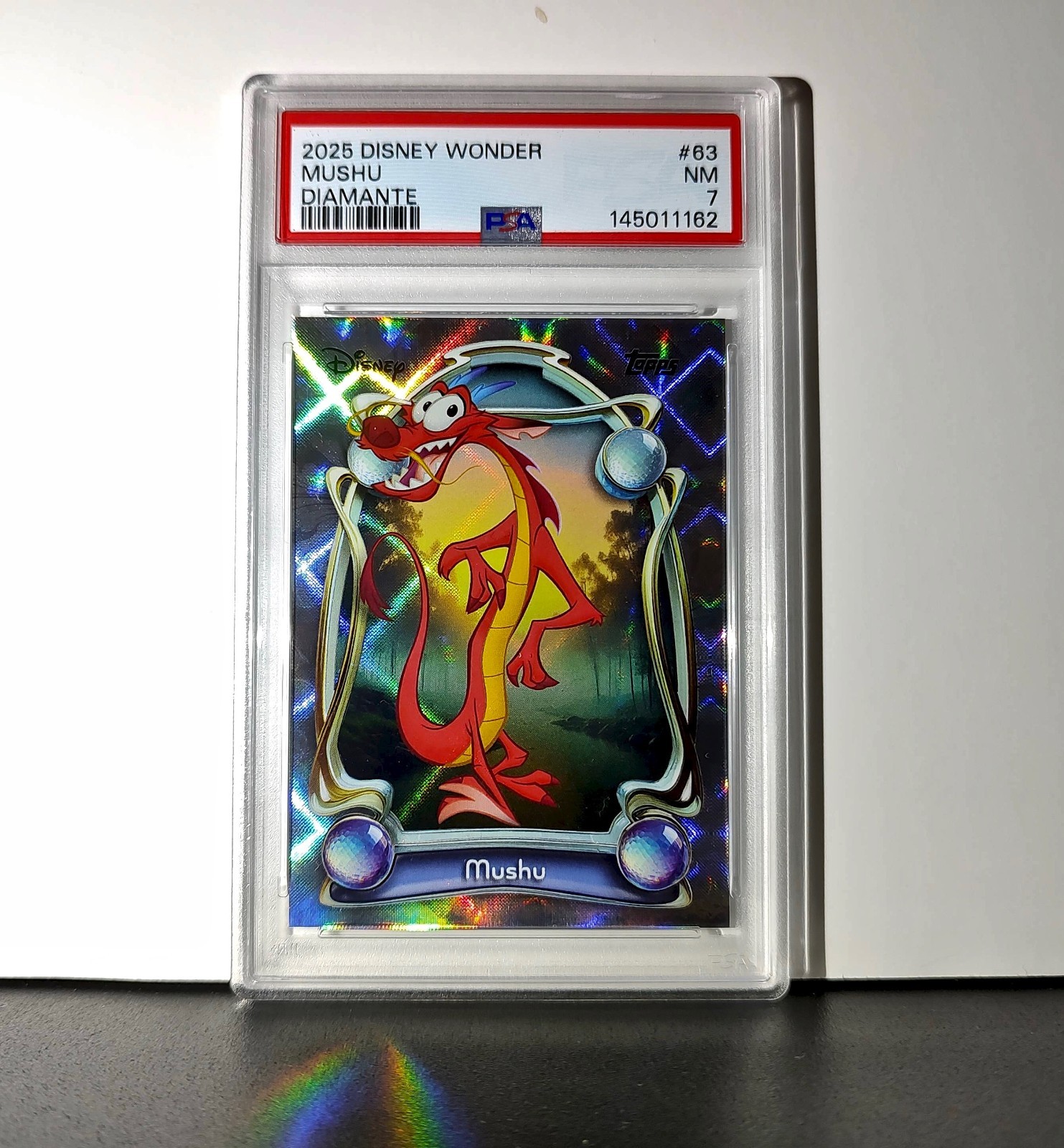Mushu 2025 Topps Disney Wonder #63 Winter Variant Card Mulan PSA 7 Mushu 2025 Topps Disney Wonder #63 Winter Variant Card Mulan PSA 7