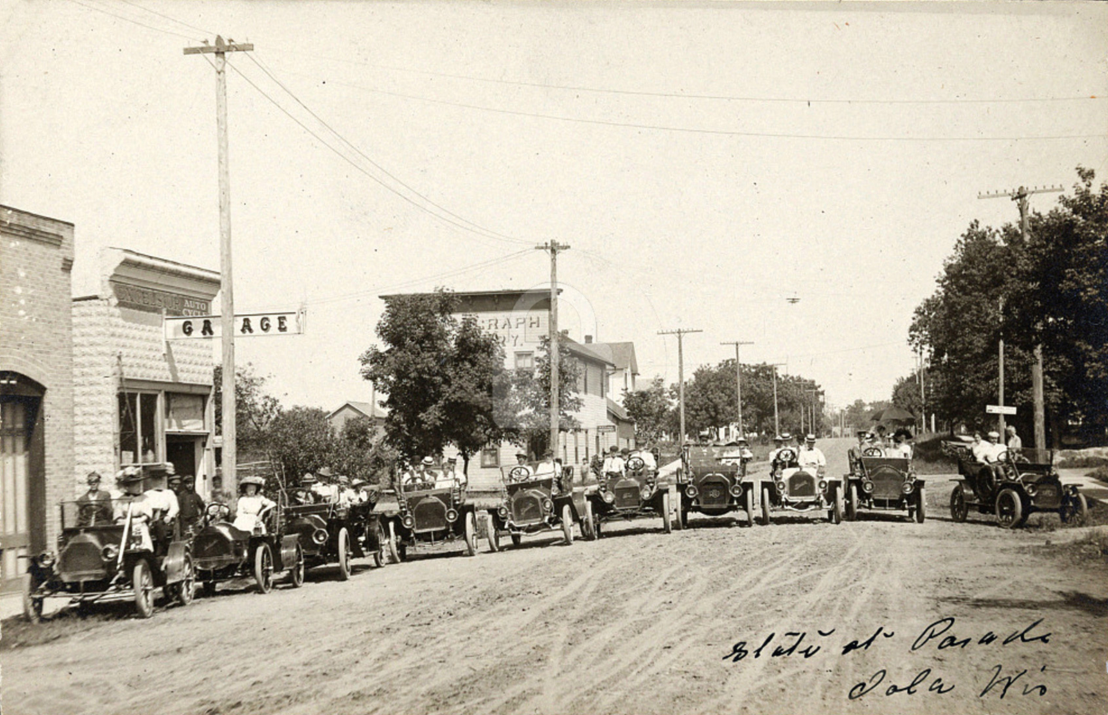 State st [i.e., Street] parade, Iola, WI Wisconsin 1911 RPPC Photo Postcard COPY