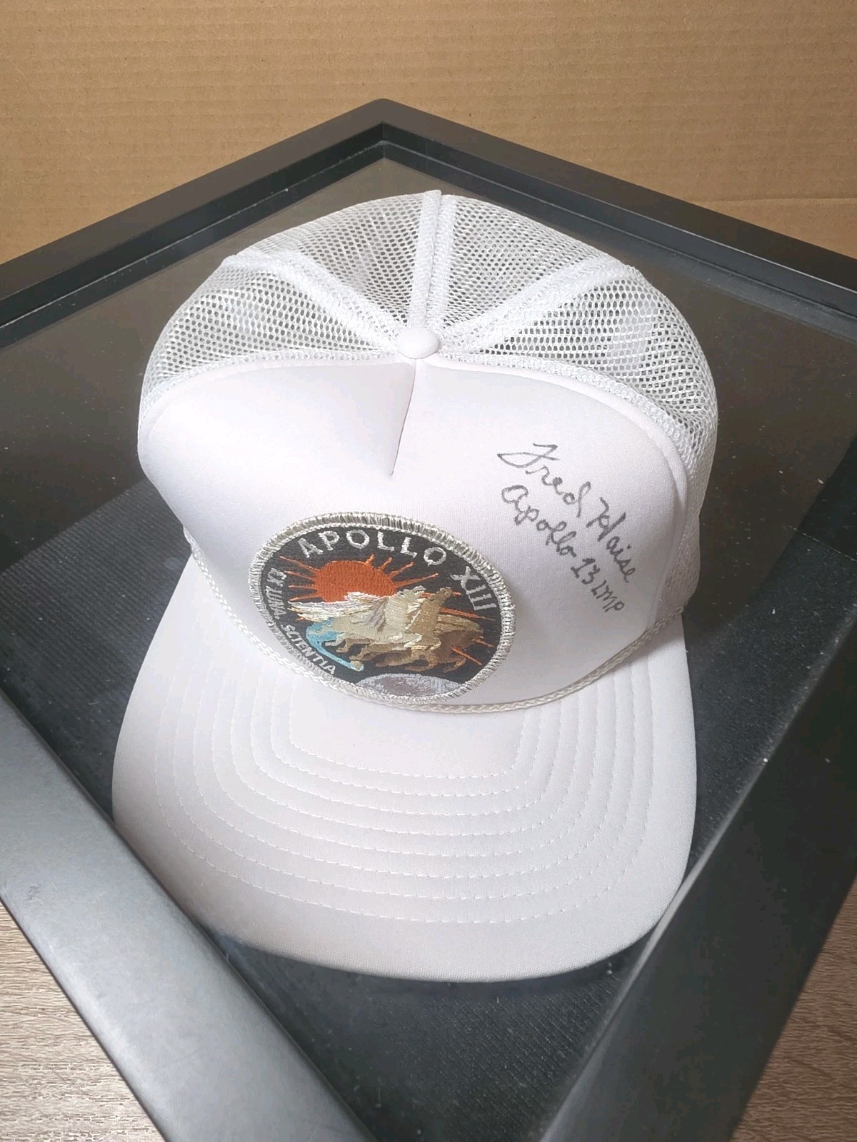 FRED HAISE Autographed Apollo 13 Hat. SIGNED NASA TRUCKER STYLE CAP (FRAMED) FRED HAISE Autographed Apollo 13 Hat. SIGNED NASA TRUCKER STYLE CAP (FRAMED)