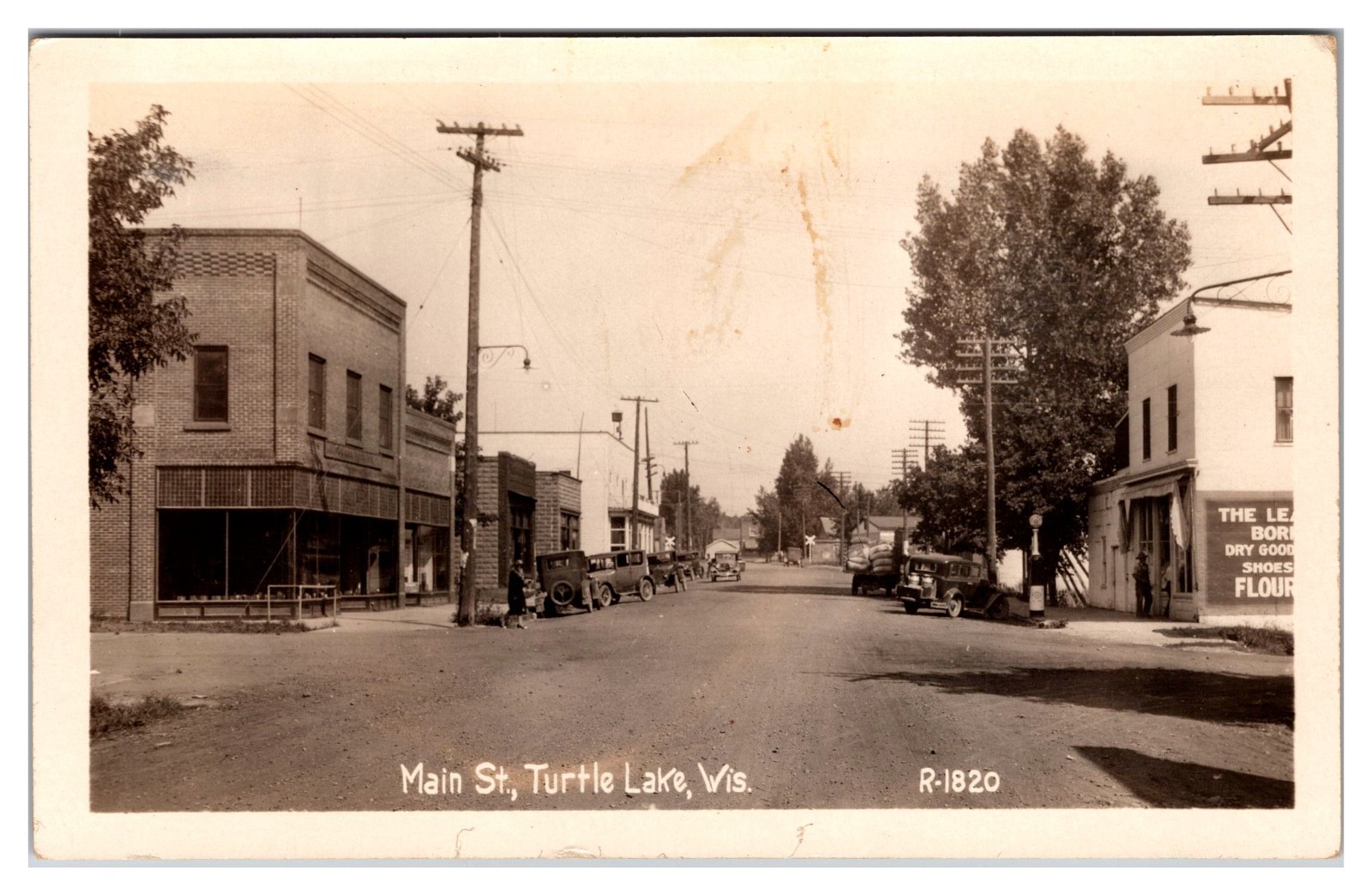  Turtle  Lake WI. Main Street 1930s  40s  RPPC Dusel Mercantile Leader Dry Goods