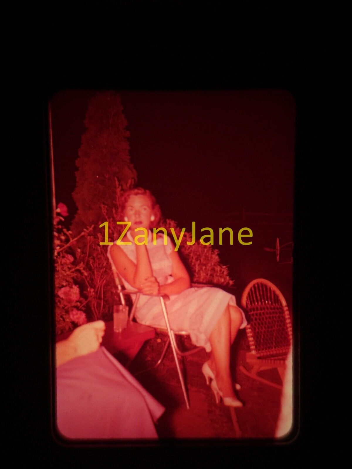 9A19 35MM SLIDE Photo , LADY SITS IN FOLDING CHAIR OUTSIDE
