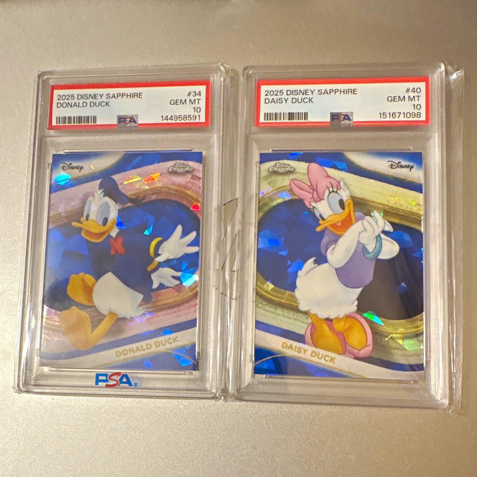 Topps 2025 Disney Sapphire Donald Duck #34 & Daisy Duck #40 both Gem Mint PSA 10