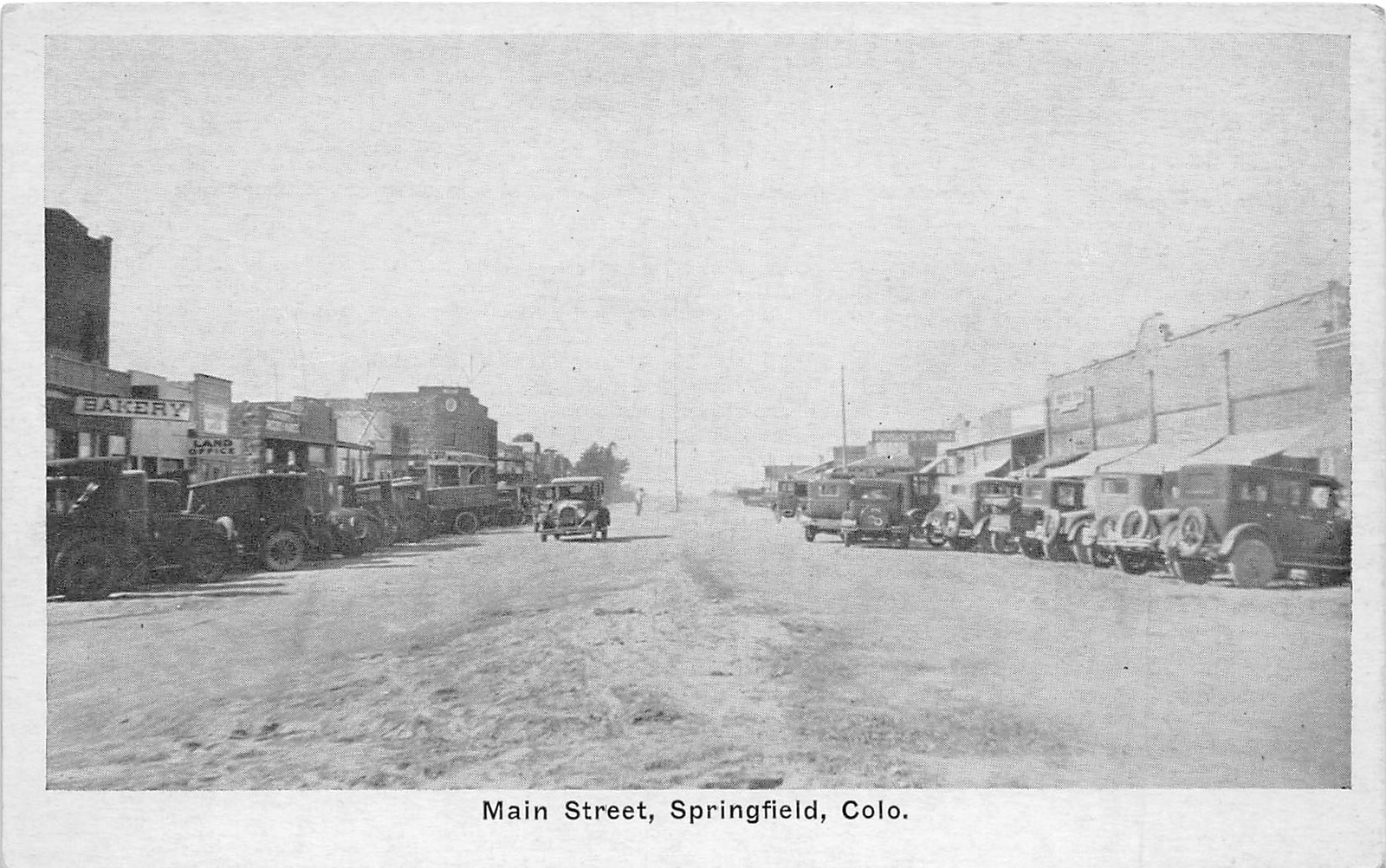 H60/ Springfield Colorado Postcard c1920 Main Street Stores Automobiles 4