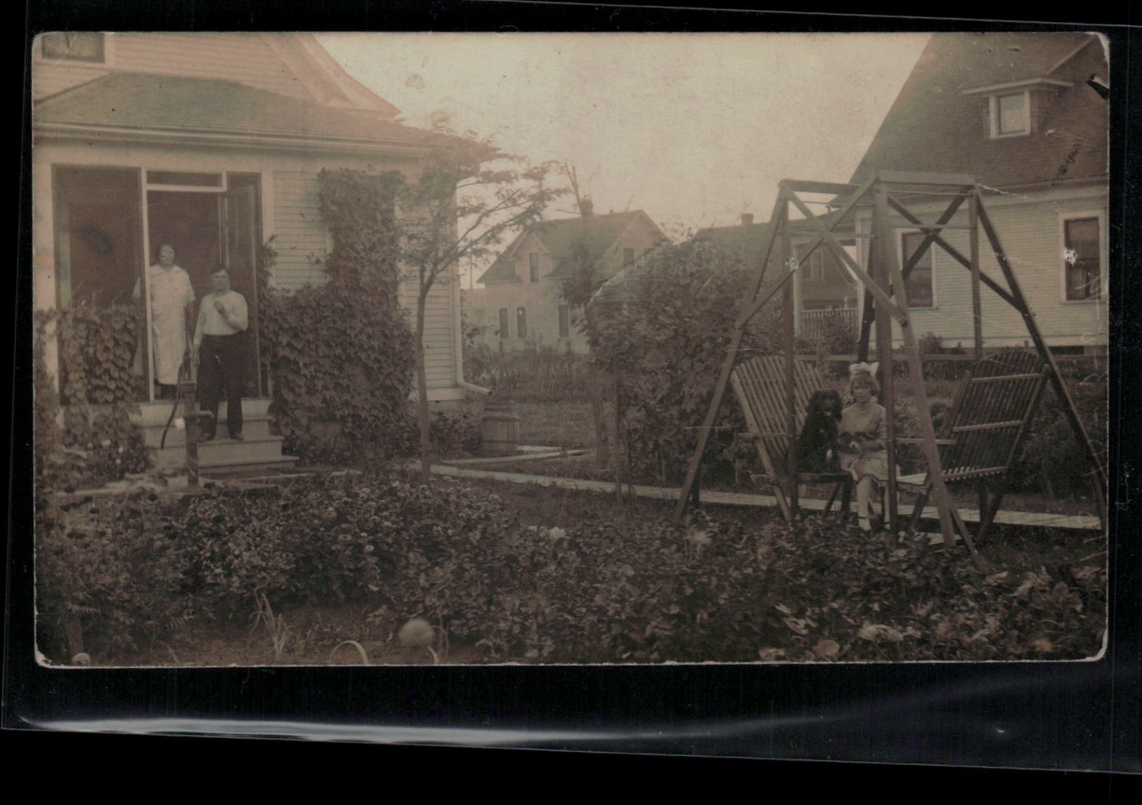 RPPC Postcard Backyard Scene, Girl with Dog on Chair, Water Pump c1914 - Trimmed RPPC Postcard Backyard Scene, Girl with Dog on Chair, Water Pump c1914 - Trimmed