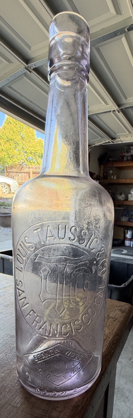 Rare antique amethyst Louis Taussig & Co San Francisco whiskey bottle Rare antique amethyst Louis Taussig & Co San Francisco whiskey bottle