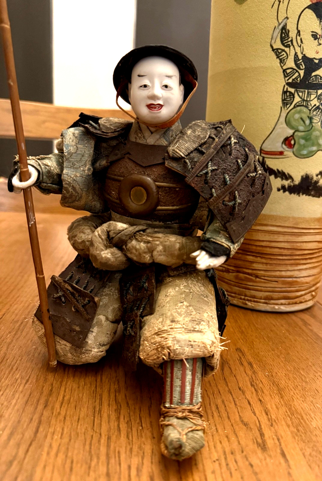 ANTIQUE JAPANESE SAMURAI DOLL HOLDING FLAG. ANTIQUE JAPANESE SAMURAI DOLL HOLDING FLAG.
