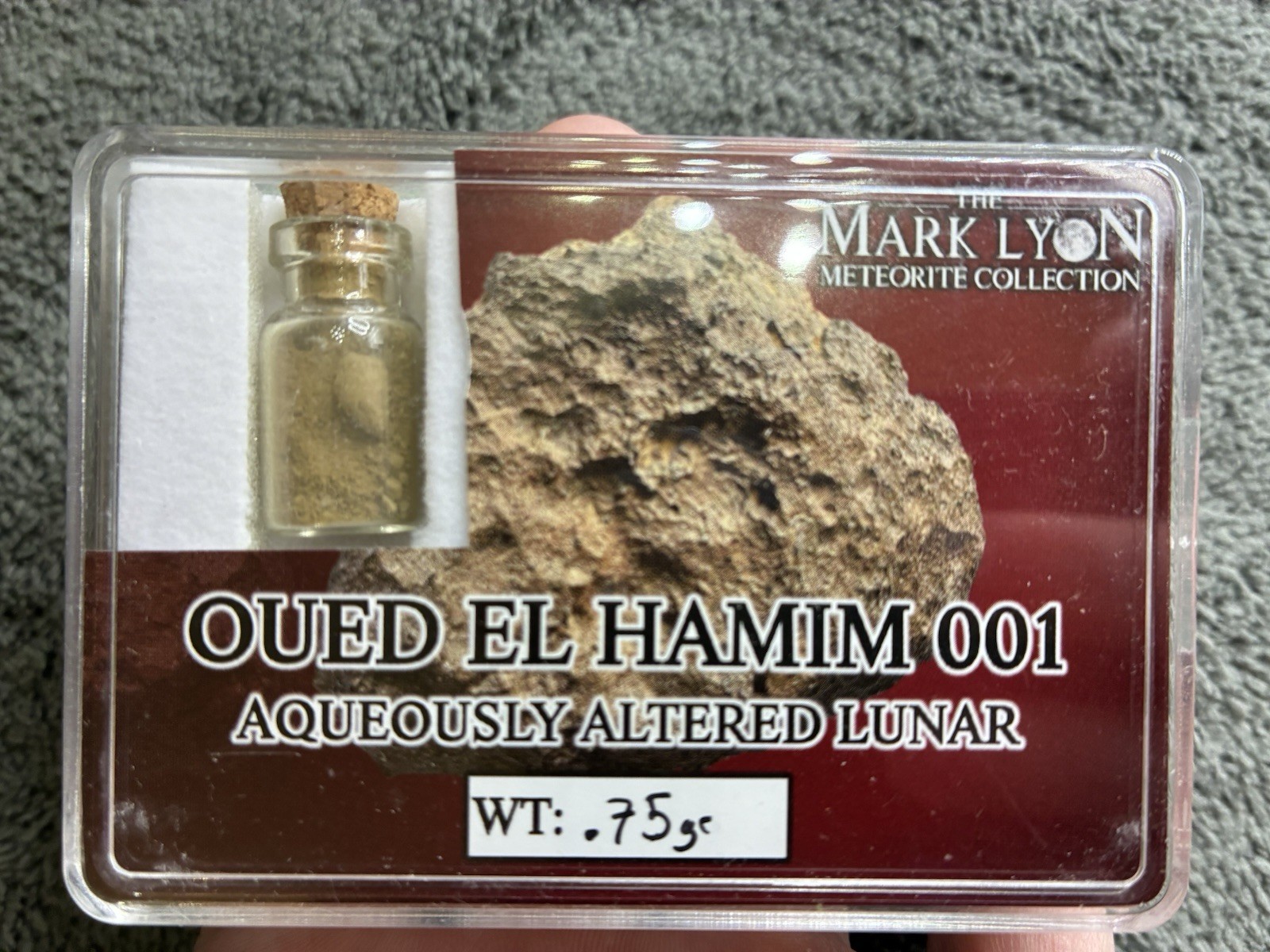Authentic Oued El Hamim 001 Lunar Meteorite Vial (0.75g) – Mark Lyon Collection Authentic Oued El Hamim 001 Lunar Meteorite Vial (0.75g) – Mark Lyon Collection