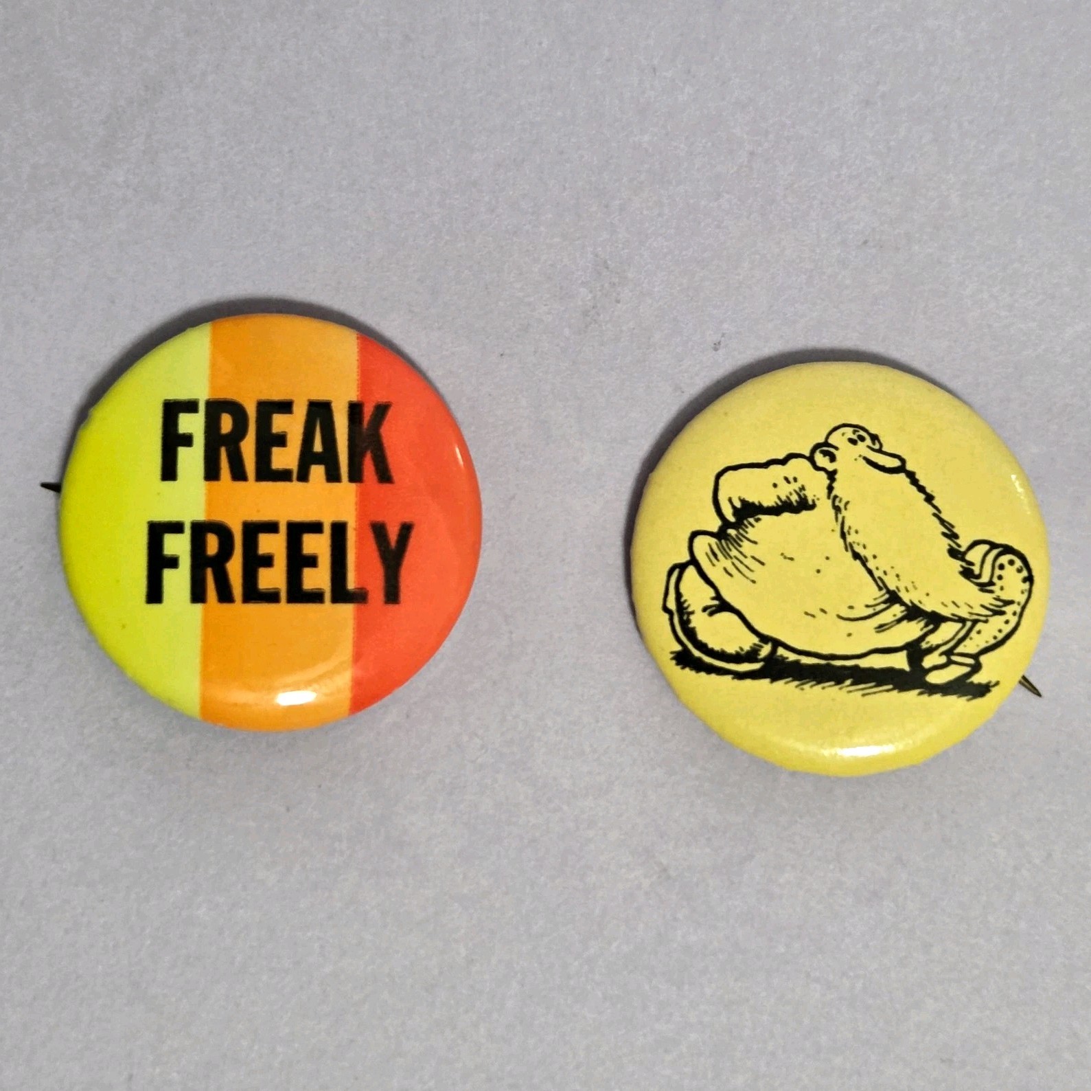 Lot of 2 Vintage Iconic Pinback Buttons “FREAK FREELY” & "Mr Natural"