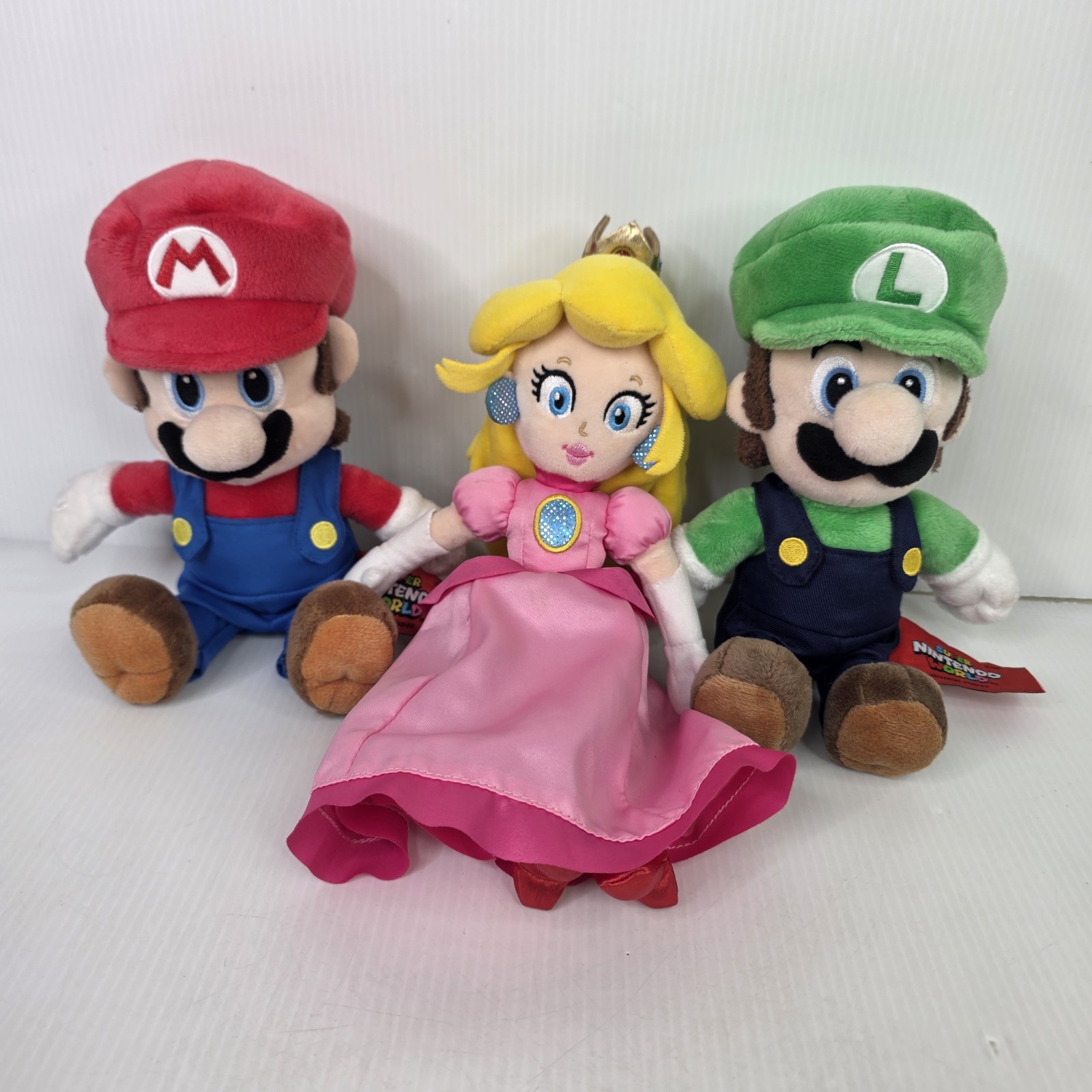 Super Nintendo World Mario, Luigi, and Peach Plush Doll Set Universal Studios Super Nintendo World Mario, Luigi, and Peach Plush Doll Set Universal Studios