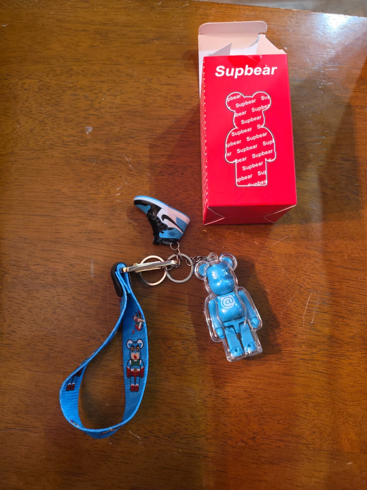 Supbear Bearbrick-Style Bear Figure Keychain w/ Metallic Blue Sneaker Charm Supbear Bearbrick-Style Bear Figure Keychain w/ Metallic Blue Sneaker Charm