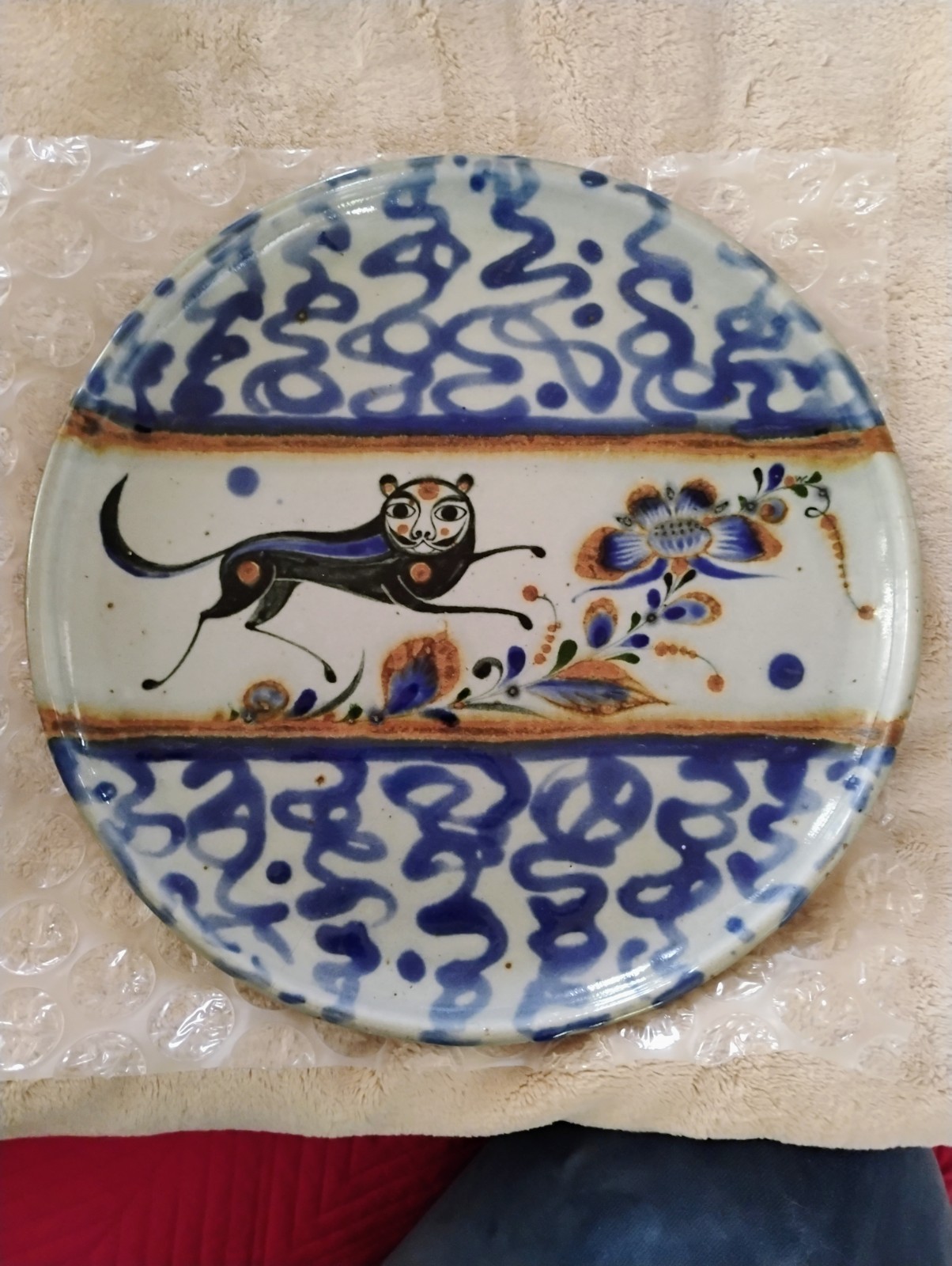 Jorge Wilmot 11" Round Plate w/imagery of A Playful Creature, Blue And...