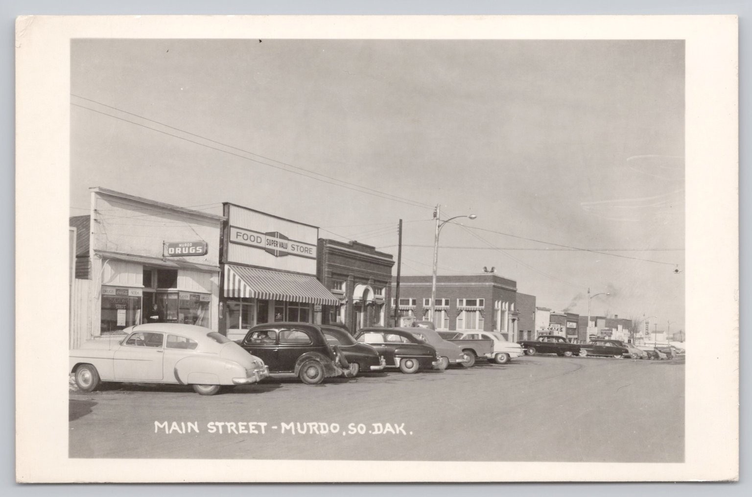 Main Street Murdo South Dakota Postcard Vintage 1950s RPPC Cars Drug Store