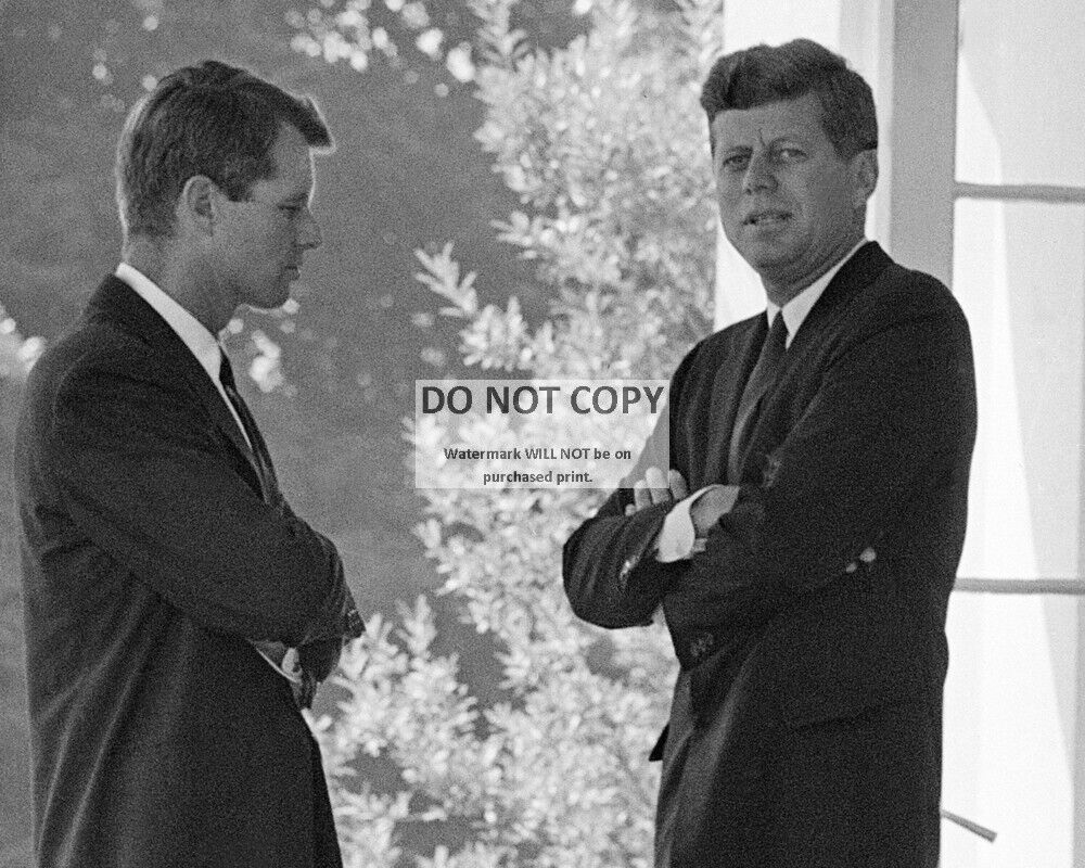 JOHN F. KENNEDY SPEAKS w/ BROTHER BOBBY AT THE WHITE HOUSE - 8X10 PHOTO (AA-753)
