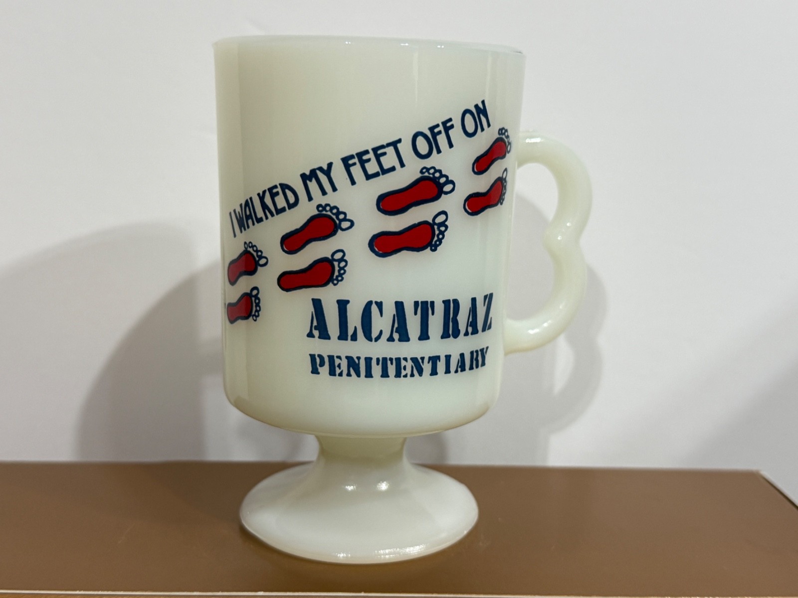 Vintage Alcatraz Penitentiary Milk Glass Pedestal Mug "I WALKED MY FEET OFF ON" Vintage Alcatraz Penitentiary Milk Glass Pedestal Mug "I WALKED MY FEET OFF ON"