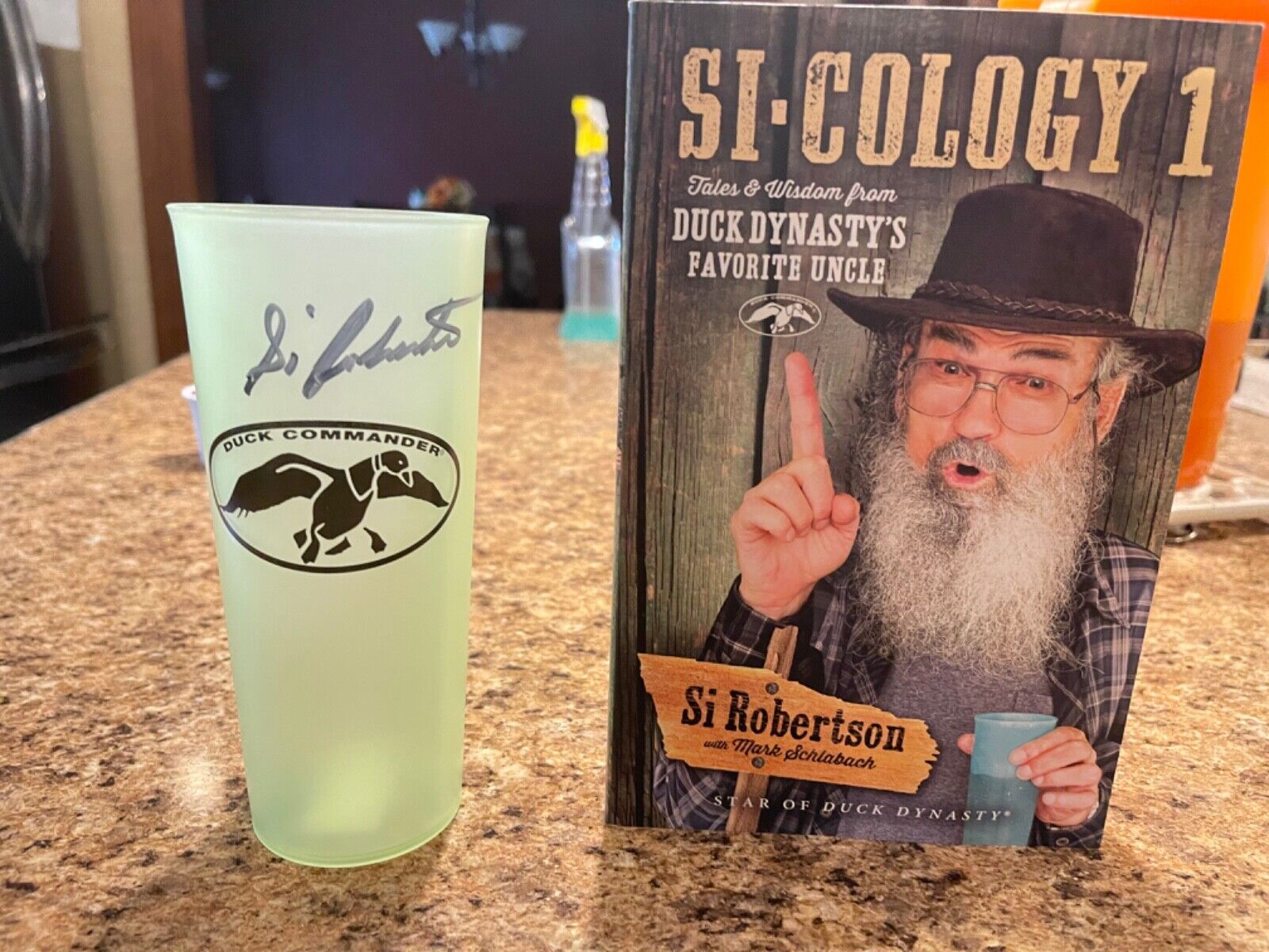 Autographed Uncle Si Robertson Cup And Book