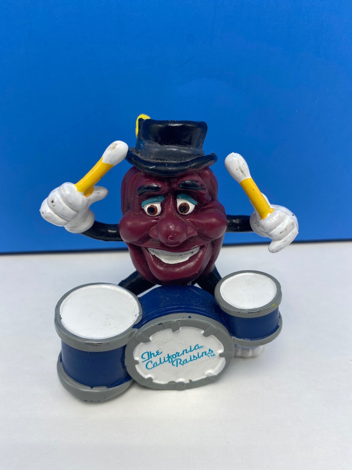 Vintage 1988 California Raisins playing the drums figurine black / yellow hat Vintage 1988 California Raisins playing the drums figurine black / yellow hat
