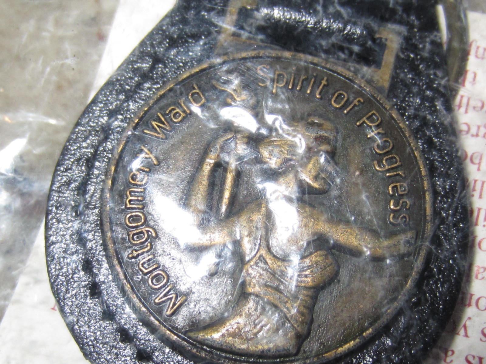 Vintage Montgomery Ward "Spirit of Progress" Leather Fob Brass Logo Key Chain Vintage Montgomery Ward "Spirit of Progress" Leather Fob Brass Logo Key Chain