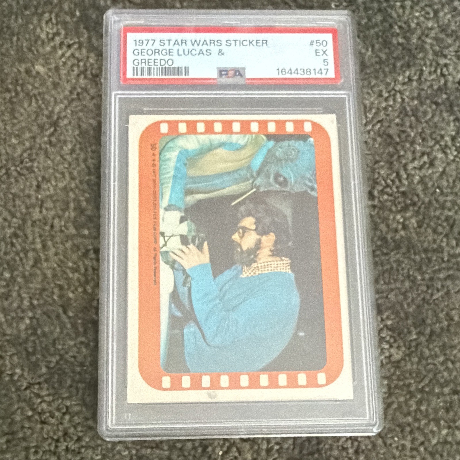 Topps 1977 Star Wars Sticker #50 George Lucas & Greedo PSA 5 Cert 164438147 Topps 1977 Star Wars Sticker #50 George Lucas & Greedo PSA 5 Cert 164438147