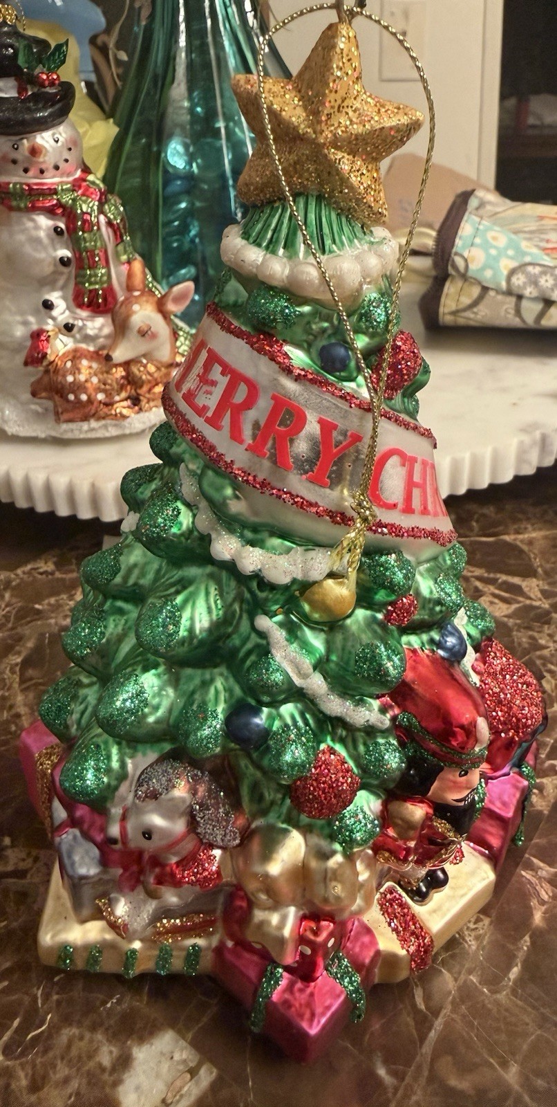 Hand Painted Blown Glass Christmas Tree Ornament Wrapped In A Decorative Banner Hand Painted Blown Glass Christmas Tree Ornament Wrapped In A Decorative Banner