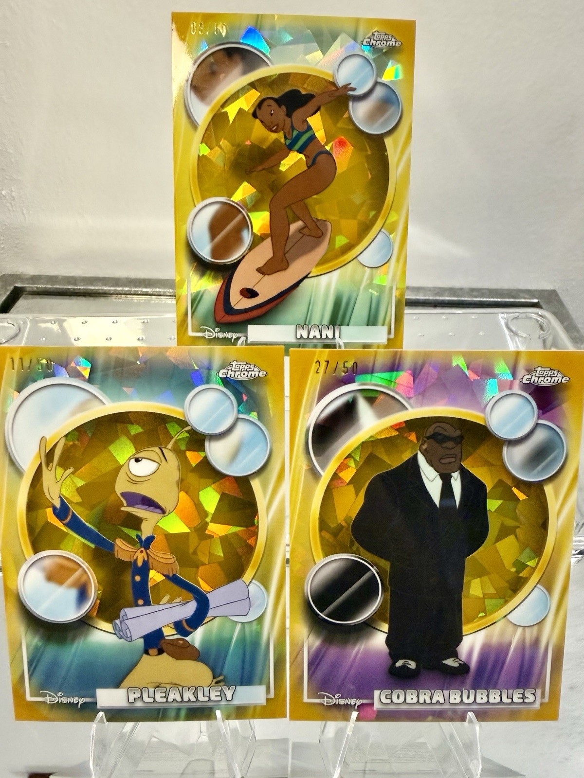 2026 Topps Chrome Sapphire Gold Refractors #/50 - Nani, Pleakley & Cobra Bubbles