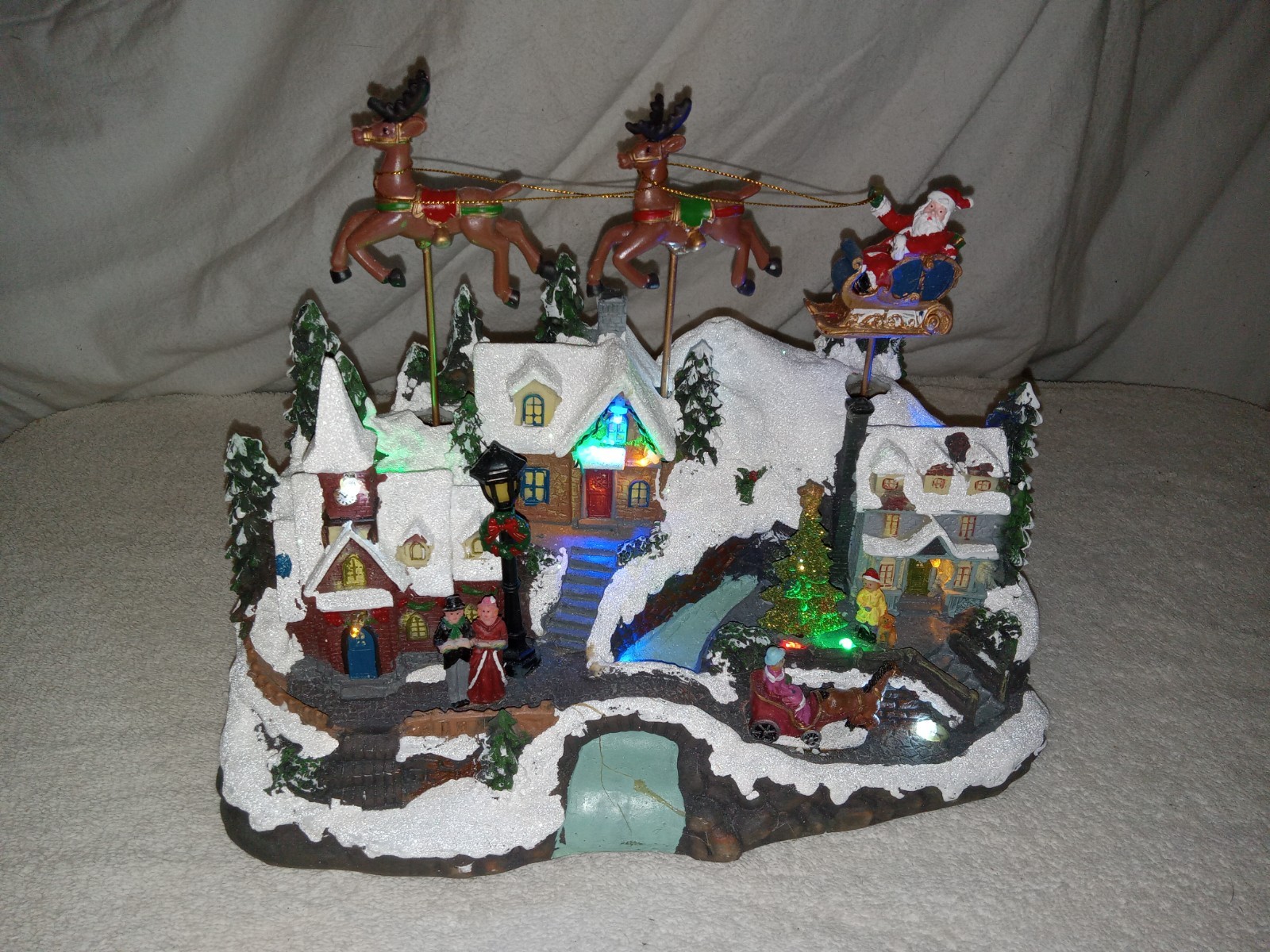 Holiday Time Lighted & Animated Flying Santa Christmas Scene Holiday Time Lighted & Animated Flying Santa Christmas Scene