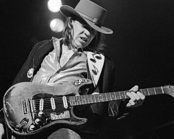 Stevie Ray Vaughan on stage performing playing his guitar 24x30 inch poster