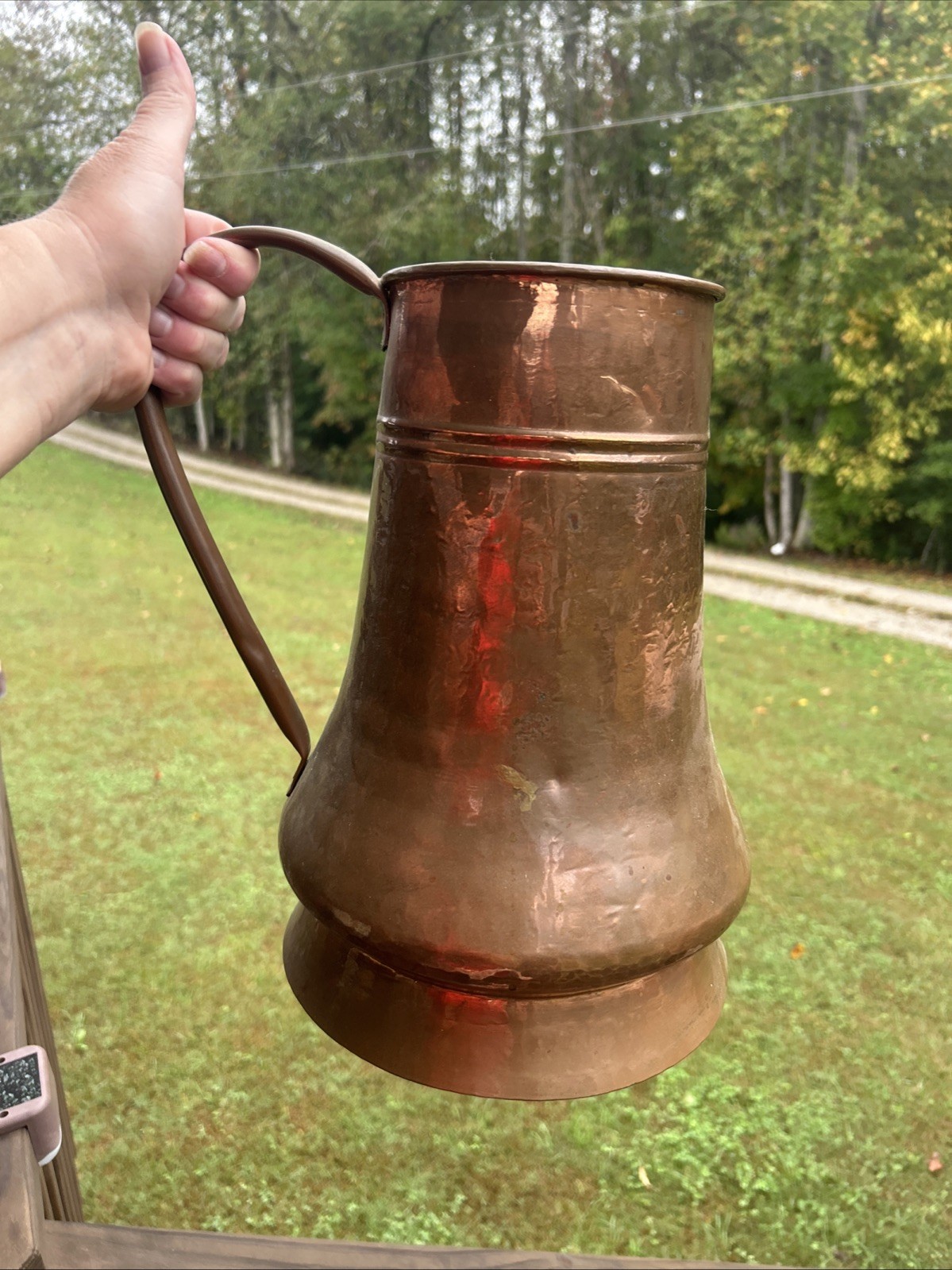 vintage or antique hand-hammered copper jug or pitcher