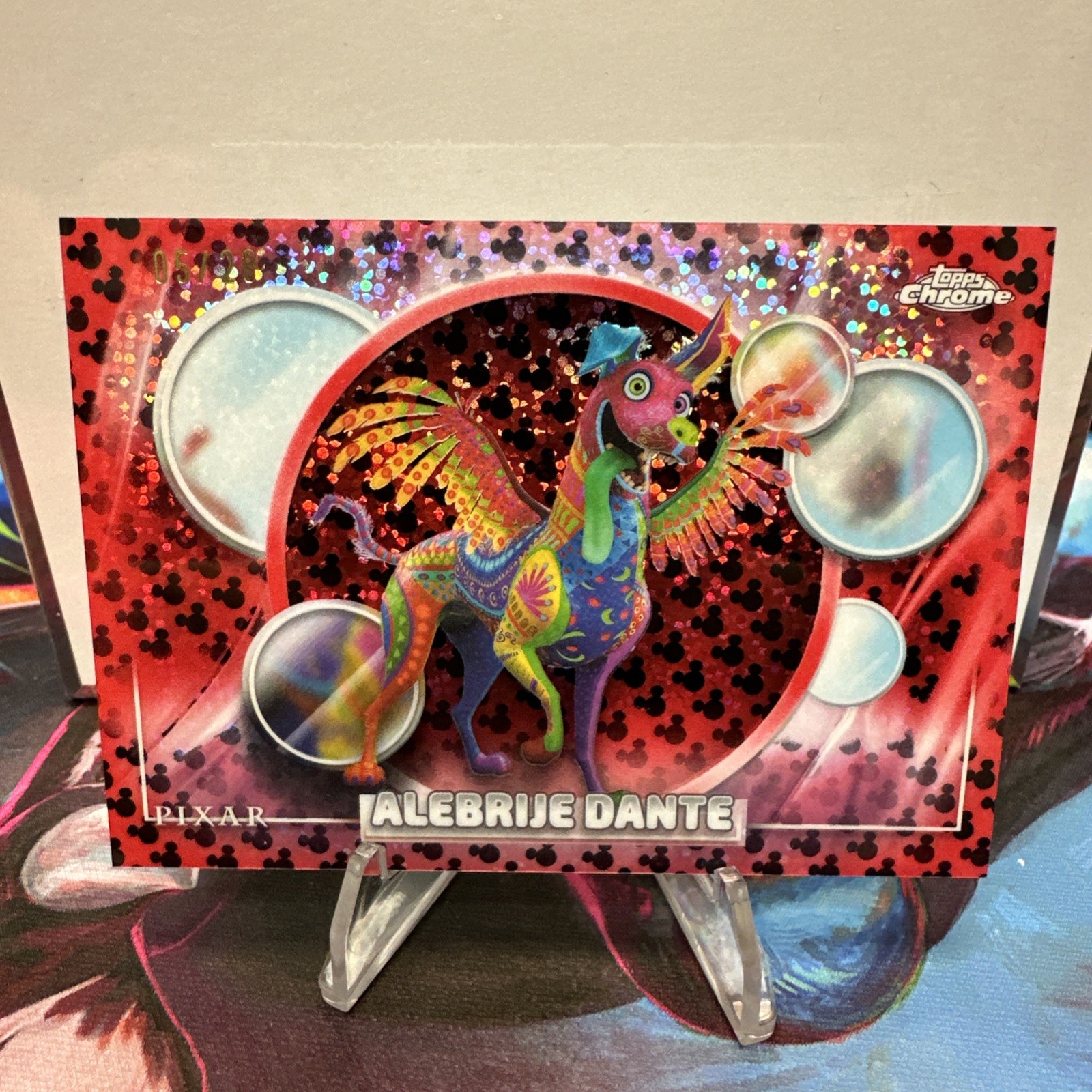 2026 Topps Chrome Disney Alebrije Dante Red Black Image Variation 05/28 SSP 2026 Topps Chrome Disney Alebrije Dante Red Black Image Variation 05/28 SSP