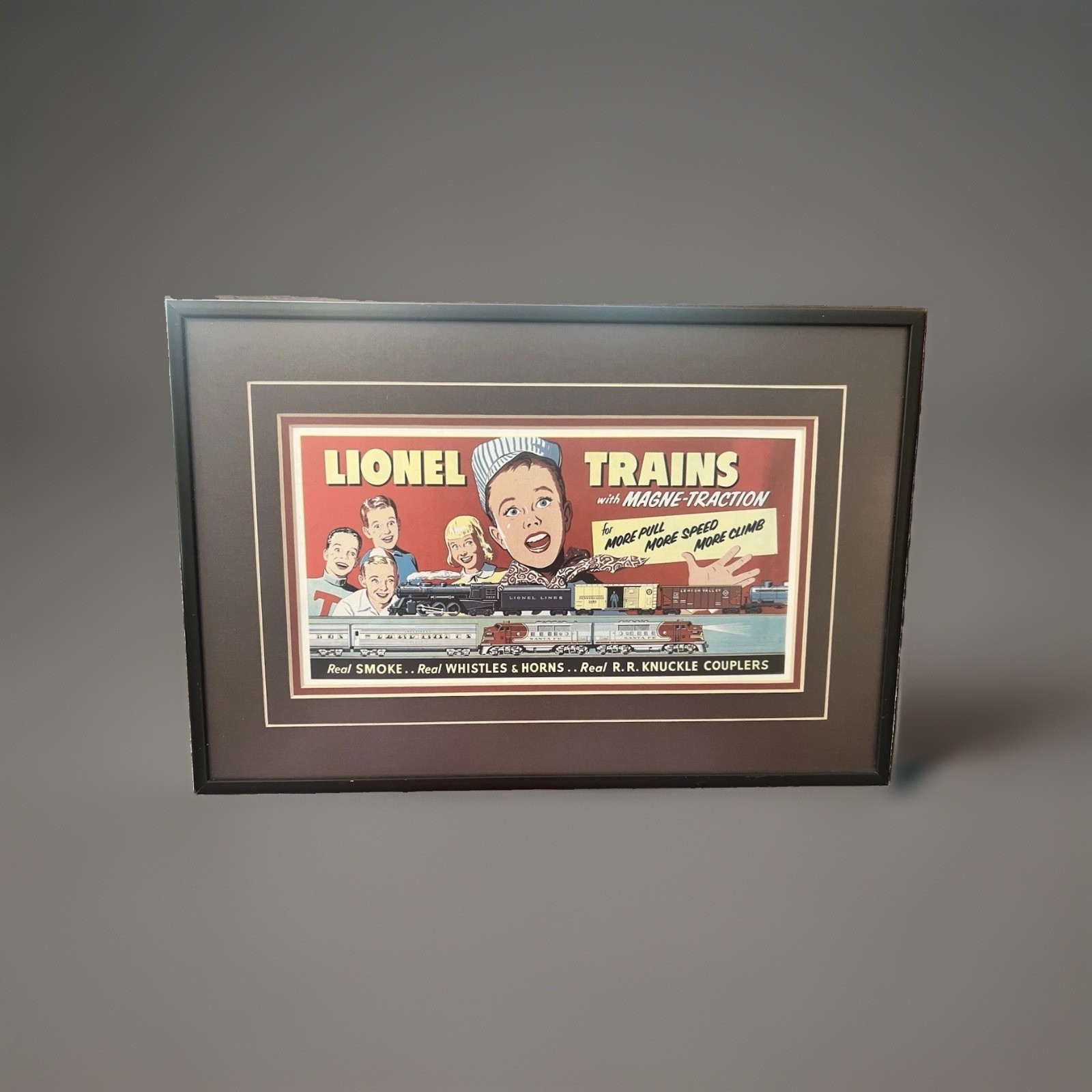 Framed Lionel Trains "Magne-Traction" Vintage-Style Advertisement Art Print Framed Lionel Trains "Magne-Traction" Vintage-Style Advertisement Art Print