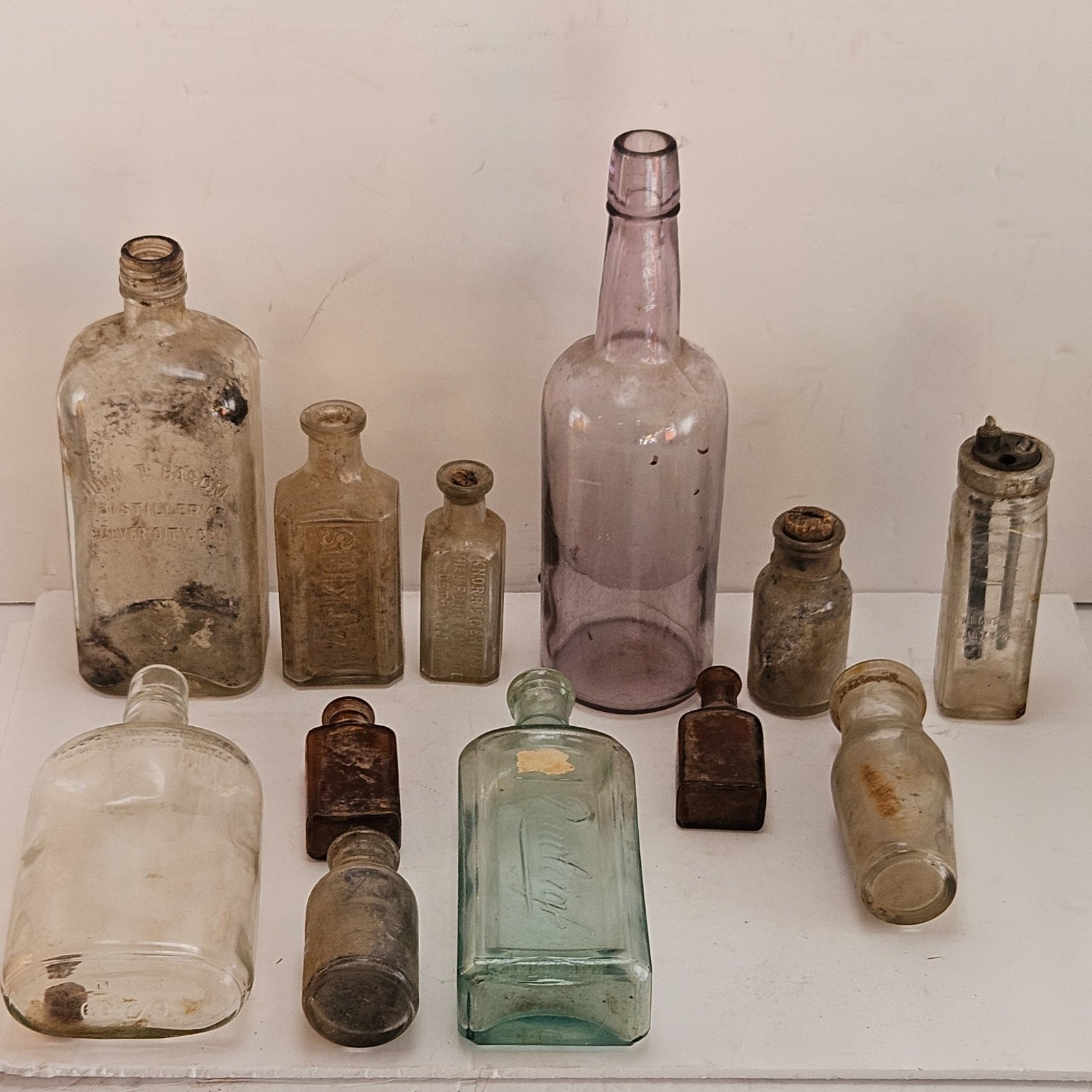 12 Antique Dug Glass Bottles Lot Purple Desert Glass Basom Distillery 1930s 12 Antique Dug Glass Bottles Lot Purple Desert Glass Basom Distillery 1930s
